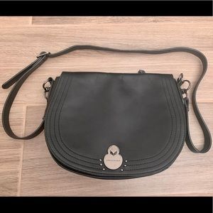 Longchamp black leather bag with silver detail.